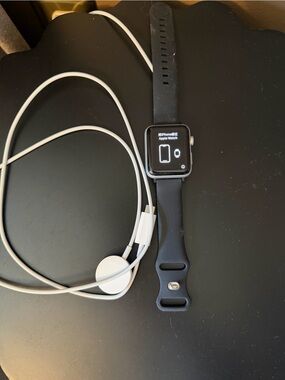 Apple Black Smartwatch 42 mm Series 3 with White Charging Cable